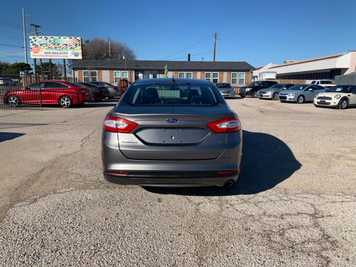 2013 Black /Black Ford Fusion (3FA6P0H79DR) with an 4 Cylinders D 1.5L DI Turbo DOHC 091 CID engine, AUTOMATIC transmission, located at 1830 North Belt Line Road, Irving, TX, 75061, (469) 524-0199, 32.834373, -96.993584 - Photo#2